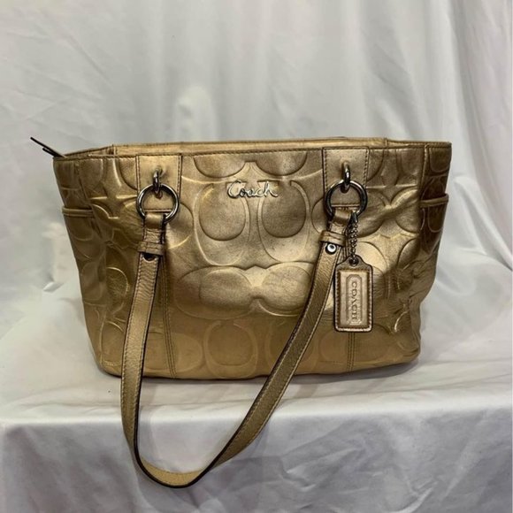 COACH gold handbag. Purple lining. Embedded coach logo. Big outside pock… - Picture 1 of 10